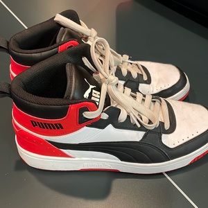 Puma rebound Joy mid tops.